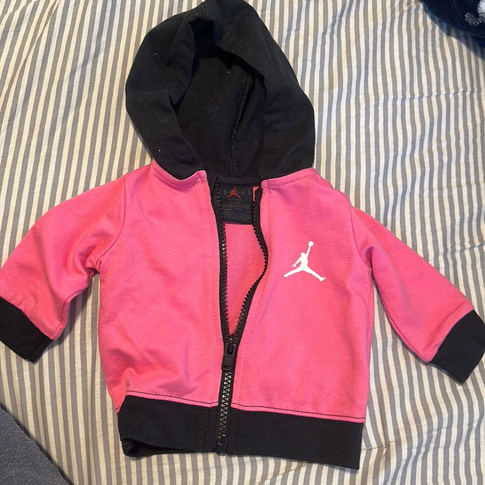 Baby girl size newborn pink and black air Jordan jacket
